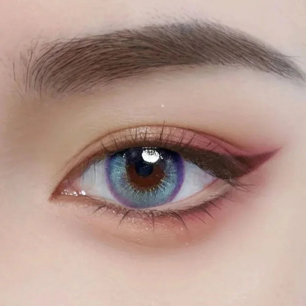 Metafantasia Blue lenses on brown eyes with subtle blue tint and limbal definition