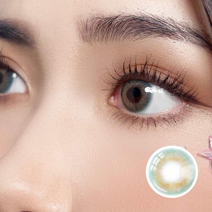 Side close-up of a model wearing Aqua Playday contact lenses, featuring soft aqua and hazel tones for a natural and vibrant eye look.
