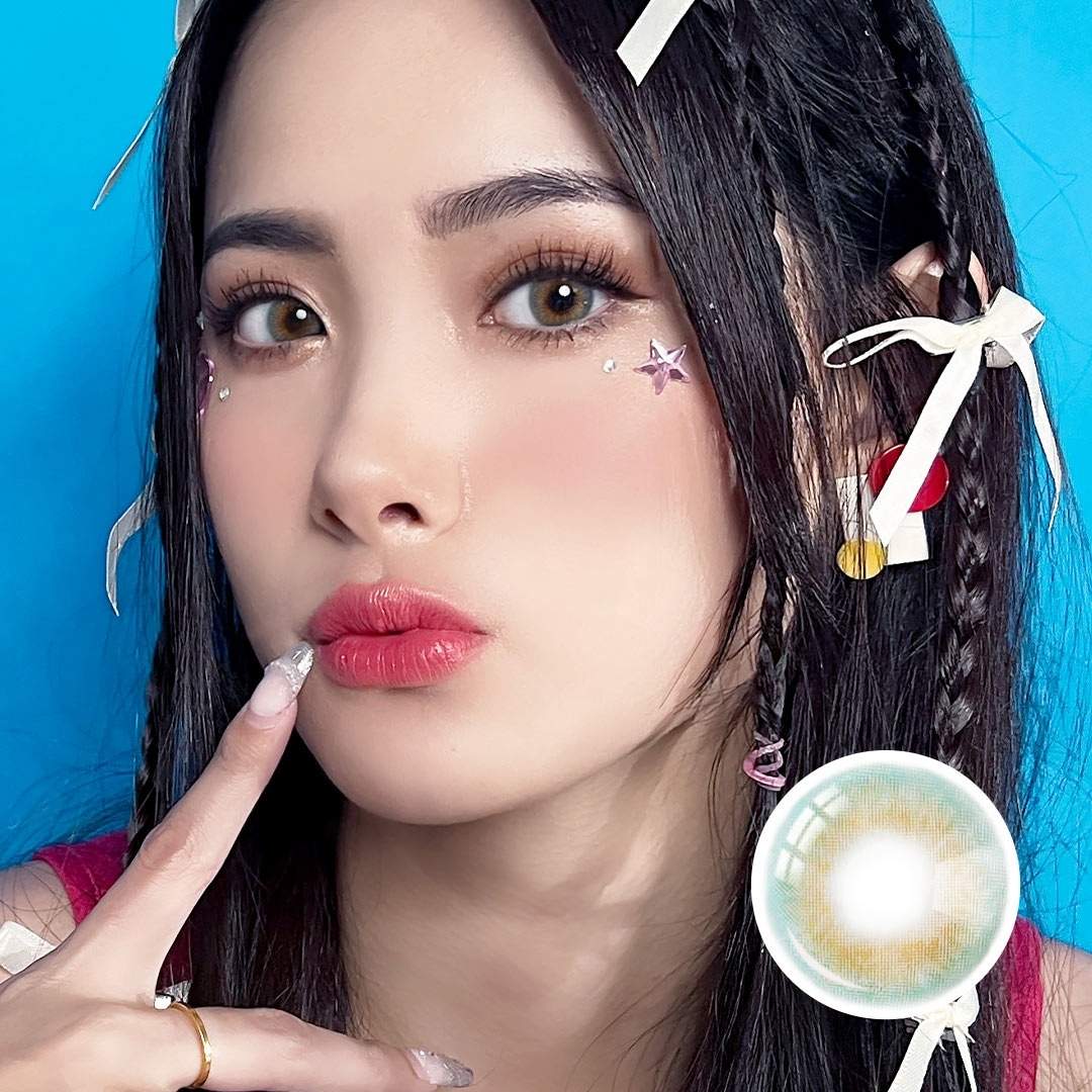 Model wearing Aqua Playday lenses, featuring vibrant aqua and hazel tones, enhancing eyes for a playful and naturally radiant look.