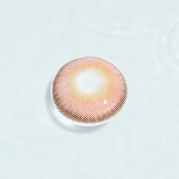Single Say Yes Idol Red lens displayed against a water-like background, showcasing its radiant red tones with a soft golden hue.