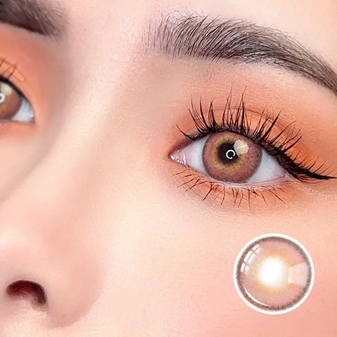 Zoomed-in view of a model wearing Say Yes Idol Red lenses, emphasizing the bold red color and pattern details.