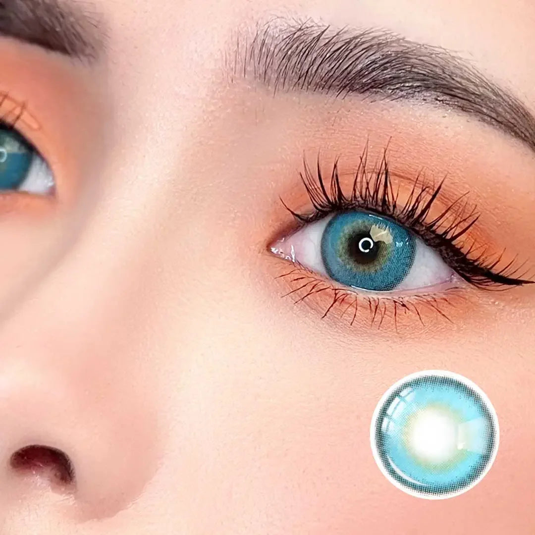 Zoomed-in image of an eye with Say Yes Very Blue lenses, emphasizing the striking aqua-blue color with natural blending for a bold yet realistic look.