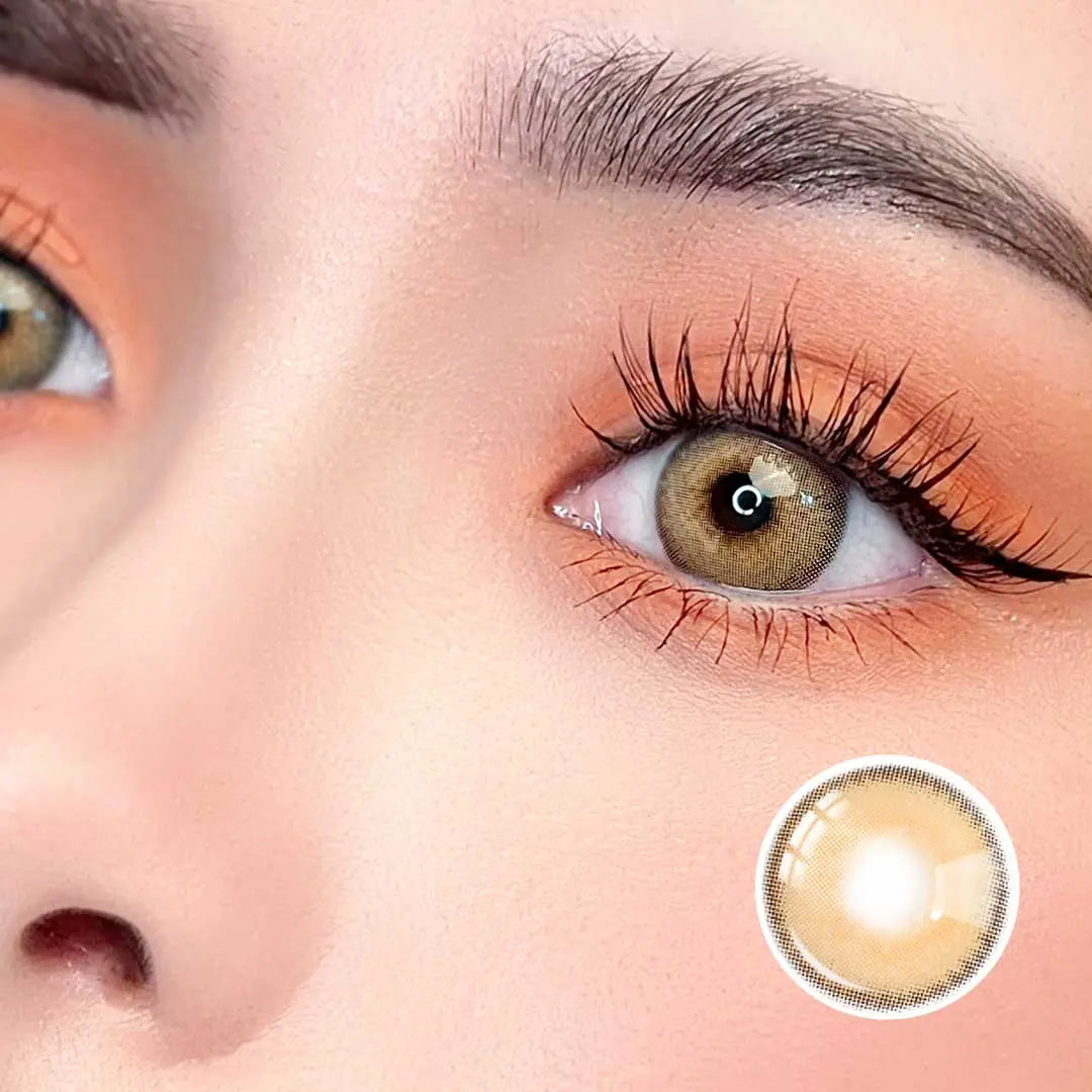 Zoomed-in view of a model wearing Say Yes Crush Brown lenses, highlighting the golden-brown accents and eye-catching details.