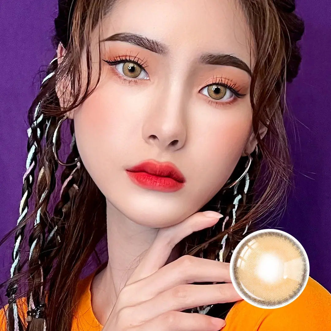 Portrait of a model wearing Say Yes Crush Brown lenses, paired with vibrant makeup and a striking hairstyle for a bold statement.