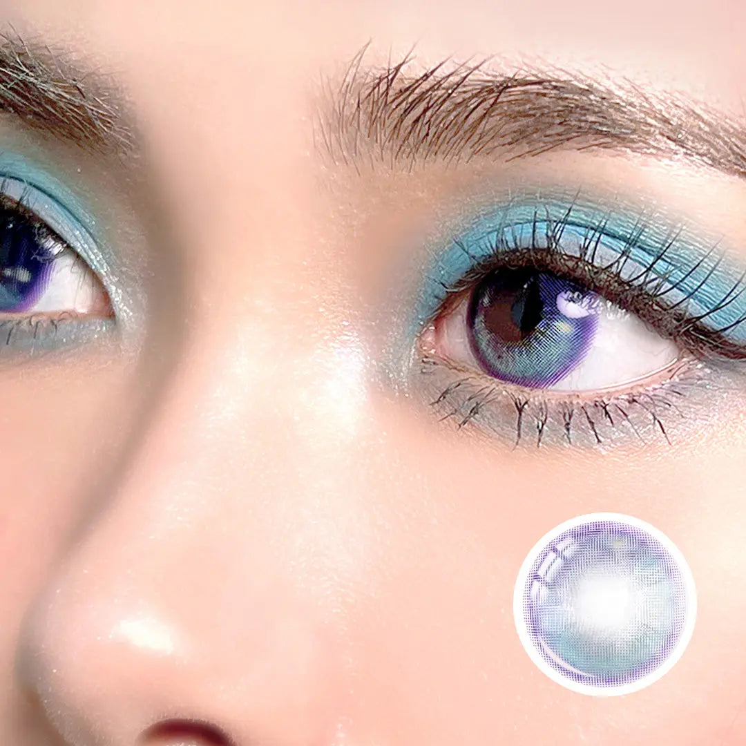 Side close-up of Metafantasia Blue contact lenses on model’s eyes, showing vibrant blue tones with futuristic makeup.