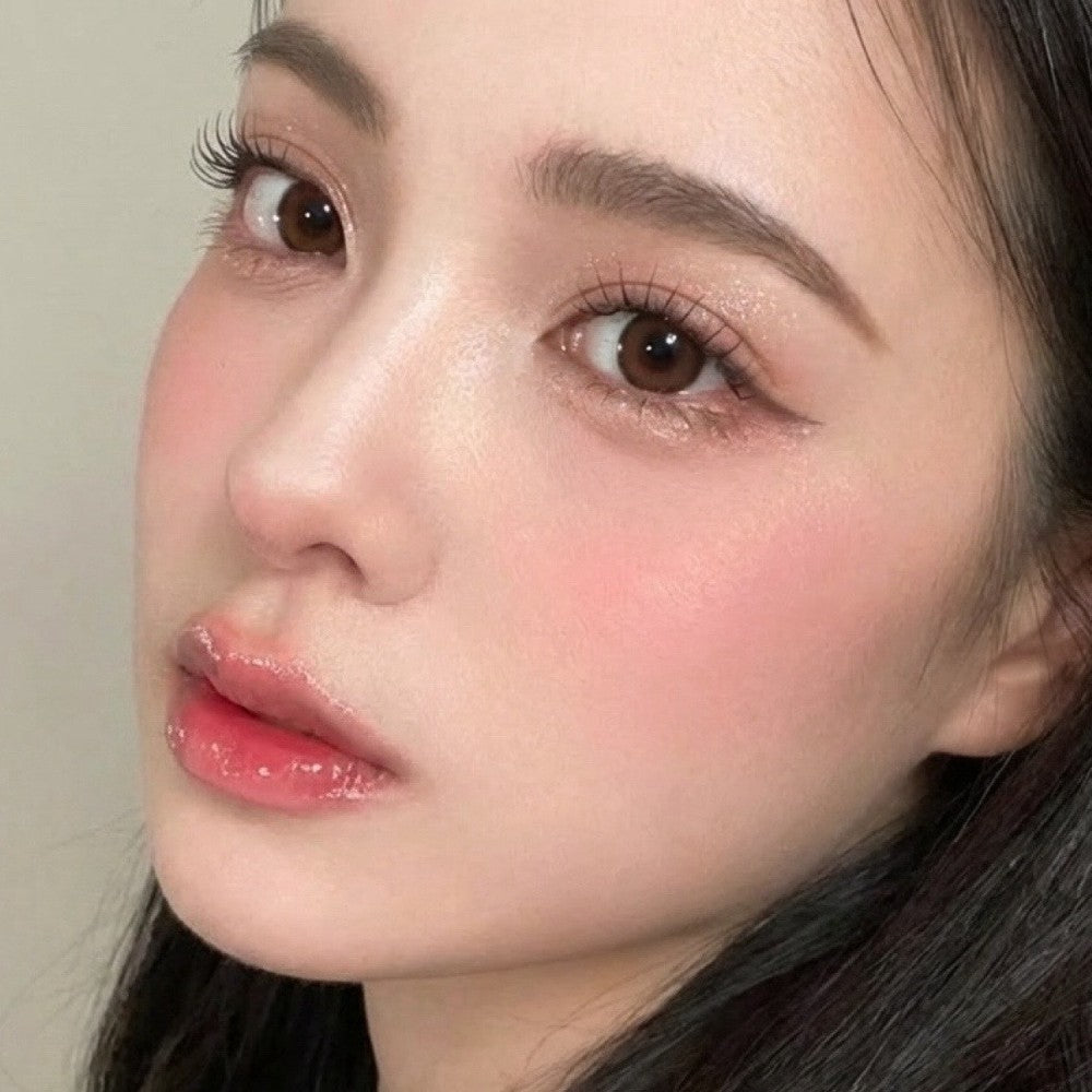 Close-up of model wearing honey brown contacts 