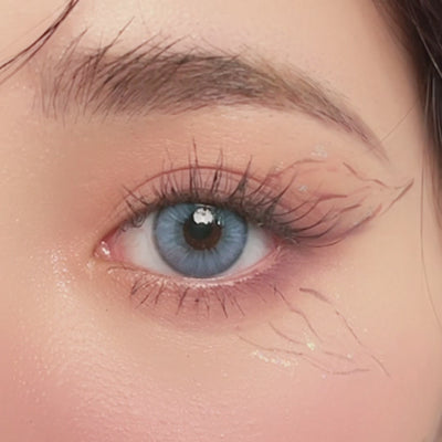 Close-up of eye wearing VISKON Pretty Blue Affair lenses with light blue color and soft blend