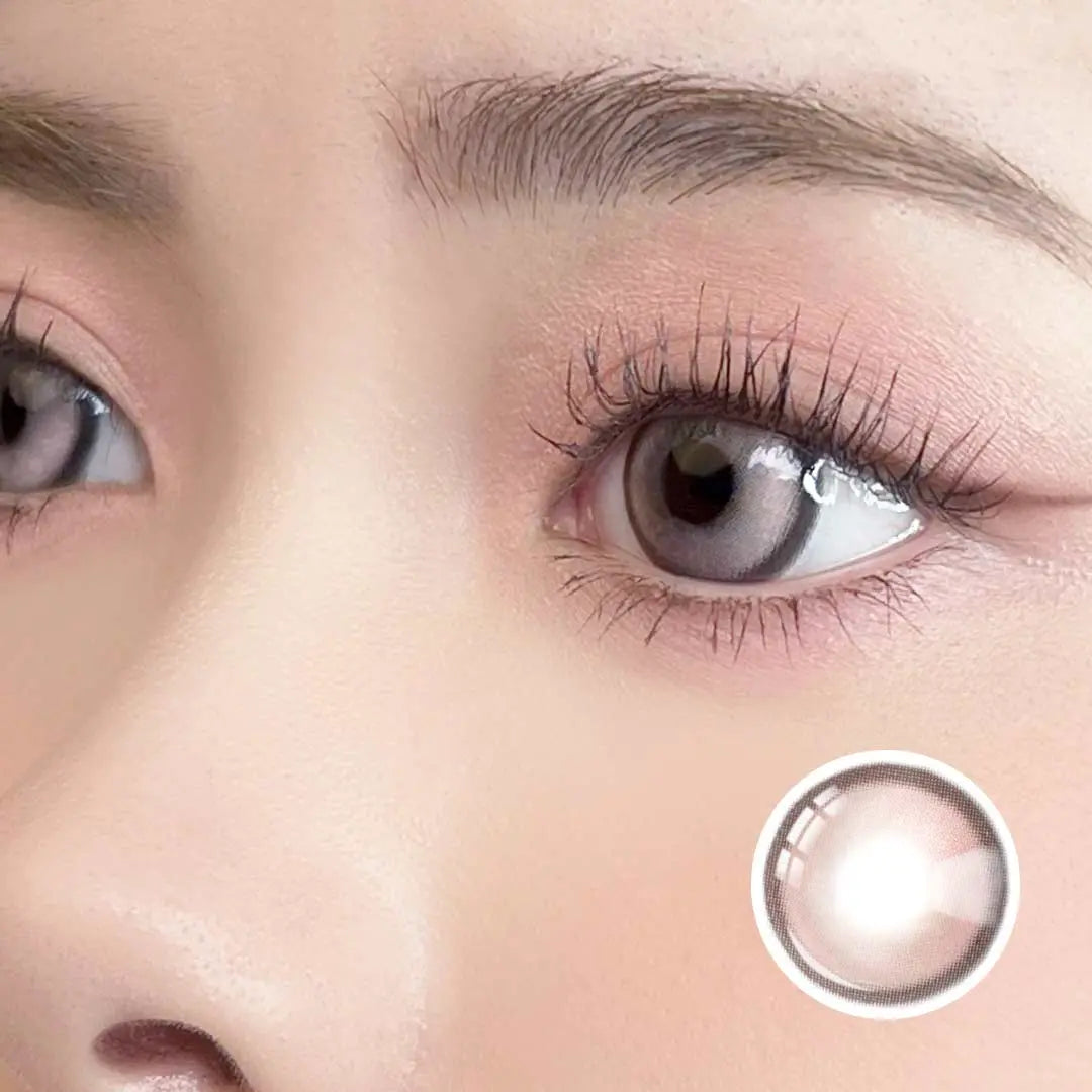 Side close-up of a model wearing Caramel Pink Chic contact lenses, showing natural pink tones and soft, chic appearance.