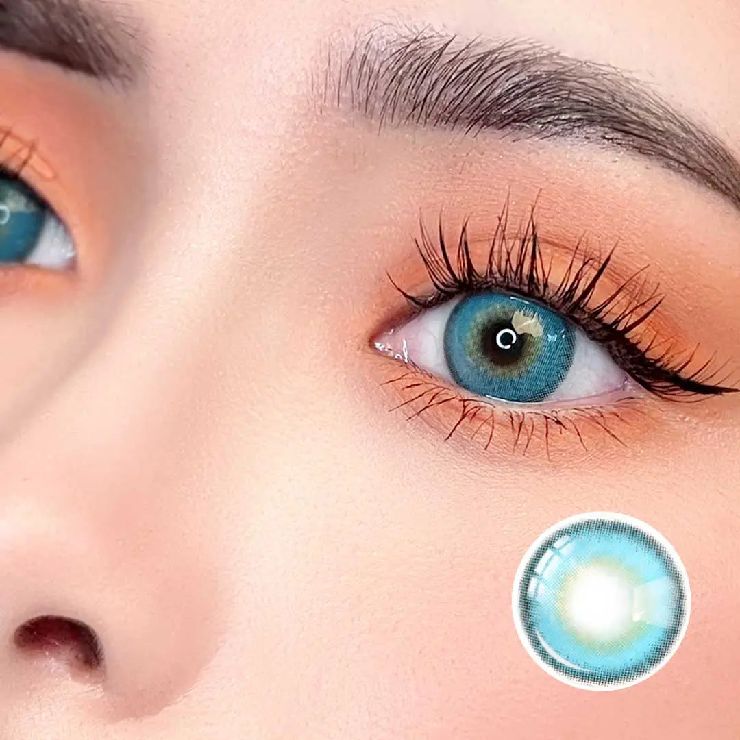 Zoomed-in image of an eye with Say Yes Very Blue lenses, emphasizing the striking aqua-blue color with natural blending for a bold yet realistic look.